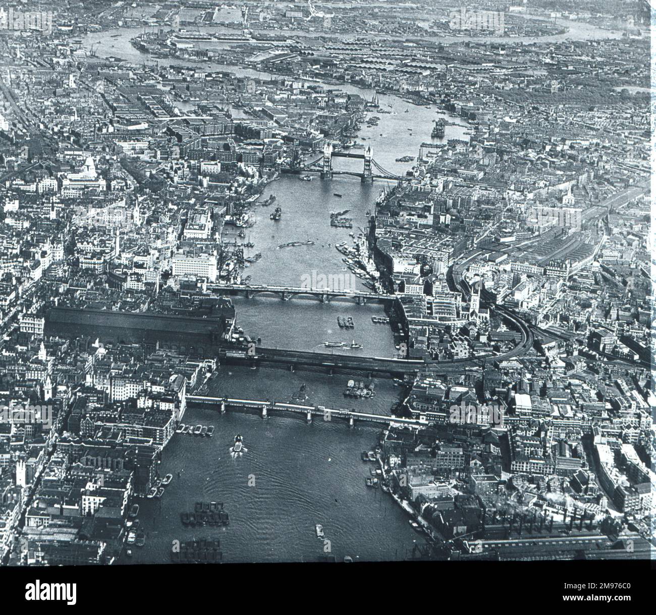 An aerial view of the River Thames looking east towards Tower Bridge. Stock Photo