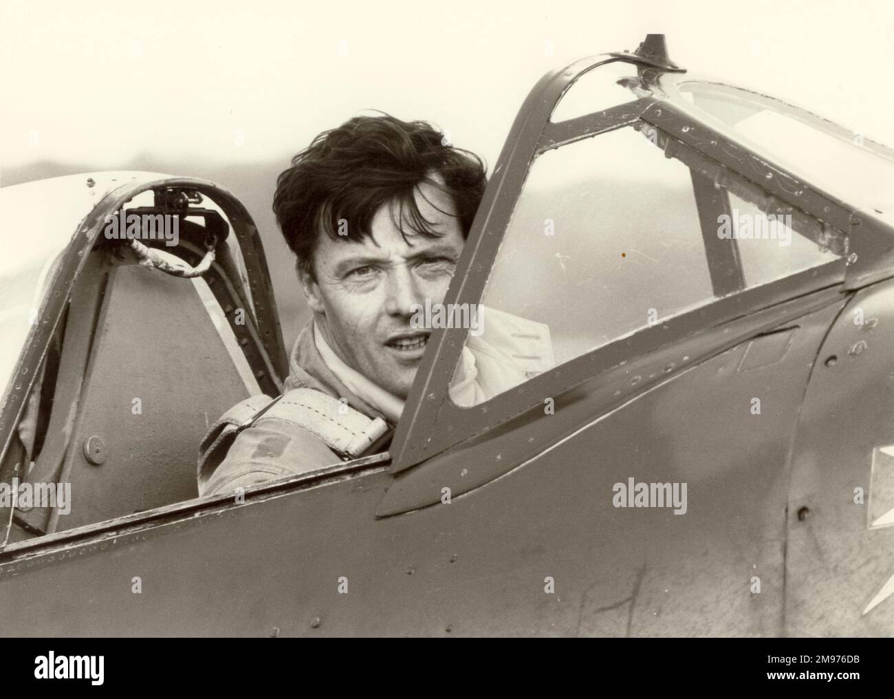 Raynham ‘Ray’ George Hanna, AFC, (1928-2005) in the cockpit of Spitfire IXB, MH434. James Gilbert photo. Stock Photo