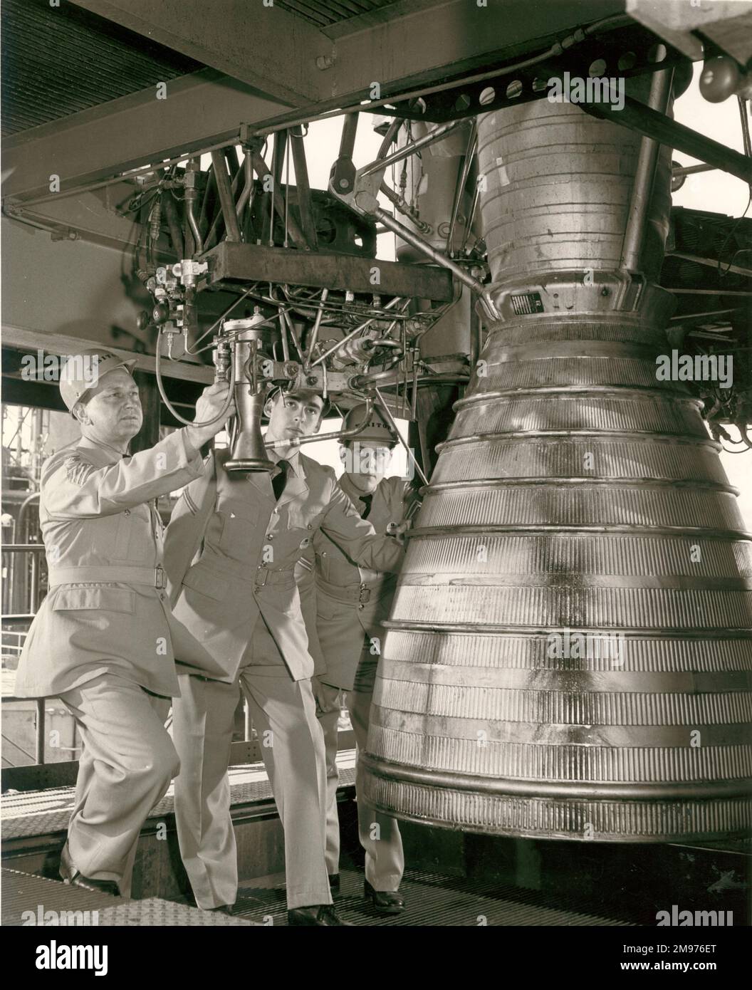 RAF personnel, completing a 13-week training course on the Thor propulsion system at Rocketdyne. From left: Chief Technician Sidney Allen, Junior Technician Graham R.J. Fryer and Corporal Technician John G. Webb. Stock Photo