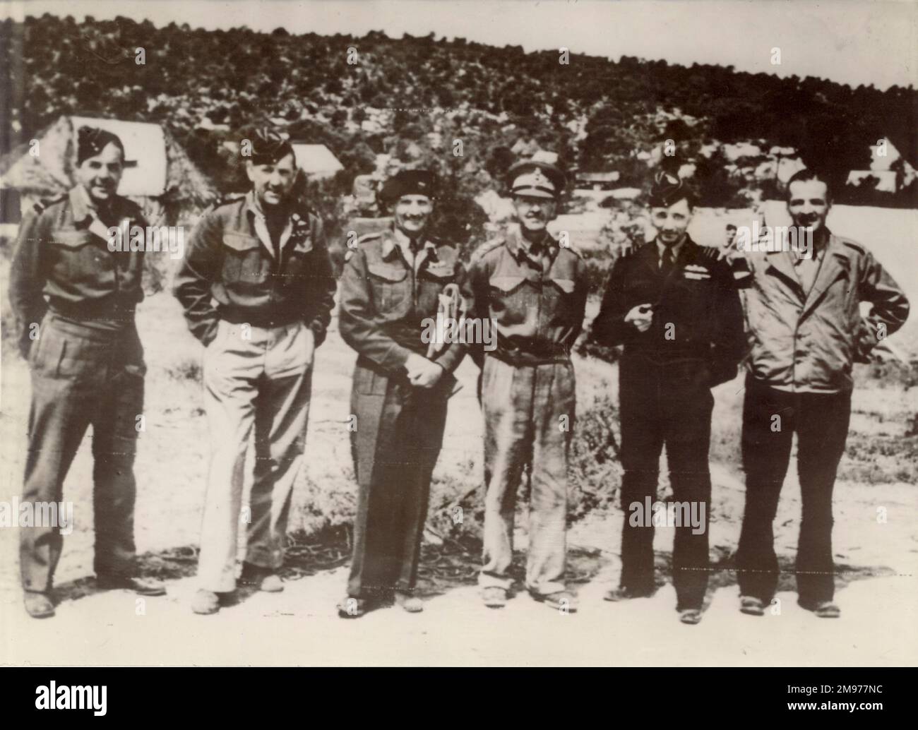 From left: Air Chief Marshal Sir Harry Broadhurst, AOC Western Front; Air Vice Marshall Arthur Coningham, AOC Tactical Air Force, Mediterranean Theatre; General Montgomery, GOO 8th Army; General Alexander, deputy C-in-C under General Eisenhower; Air Chief Marshal Tedder, AOC-in-C Mediterranean and Brigadier General L.S. Kuter of the US Army meeting in Tunis in 1943. Stock Photo