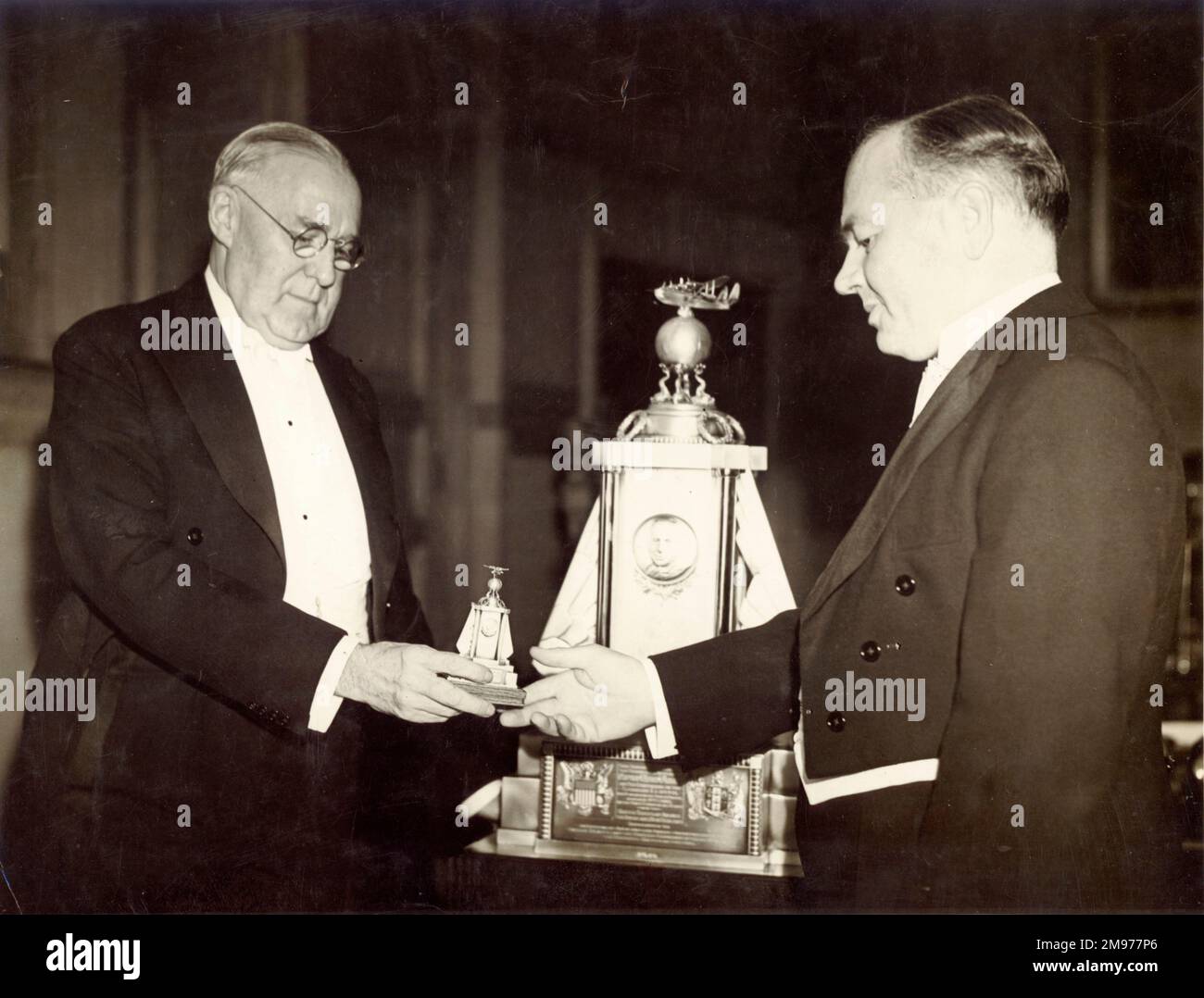 Lester Durand Gardner (1876-1956), left, presents the Musick Trophy to Arthur Gouge from Short Brothers in 1939. Stock Photo