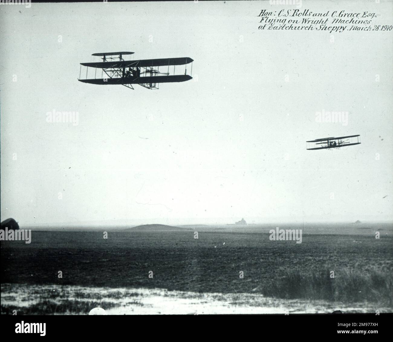 Cecil Stanley Grace and The Hon Charles Stewart Rolls flying Short-Wright biplanes at Eastchurch on 28 March 1910. It was to these flyers that a memorial window was inserted in Eastchurch parish church and unveiled by the Archbishop of Canterbury in August 1912. Stock Photo
