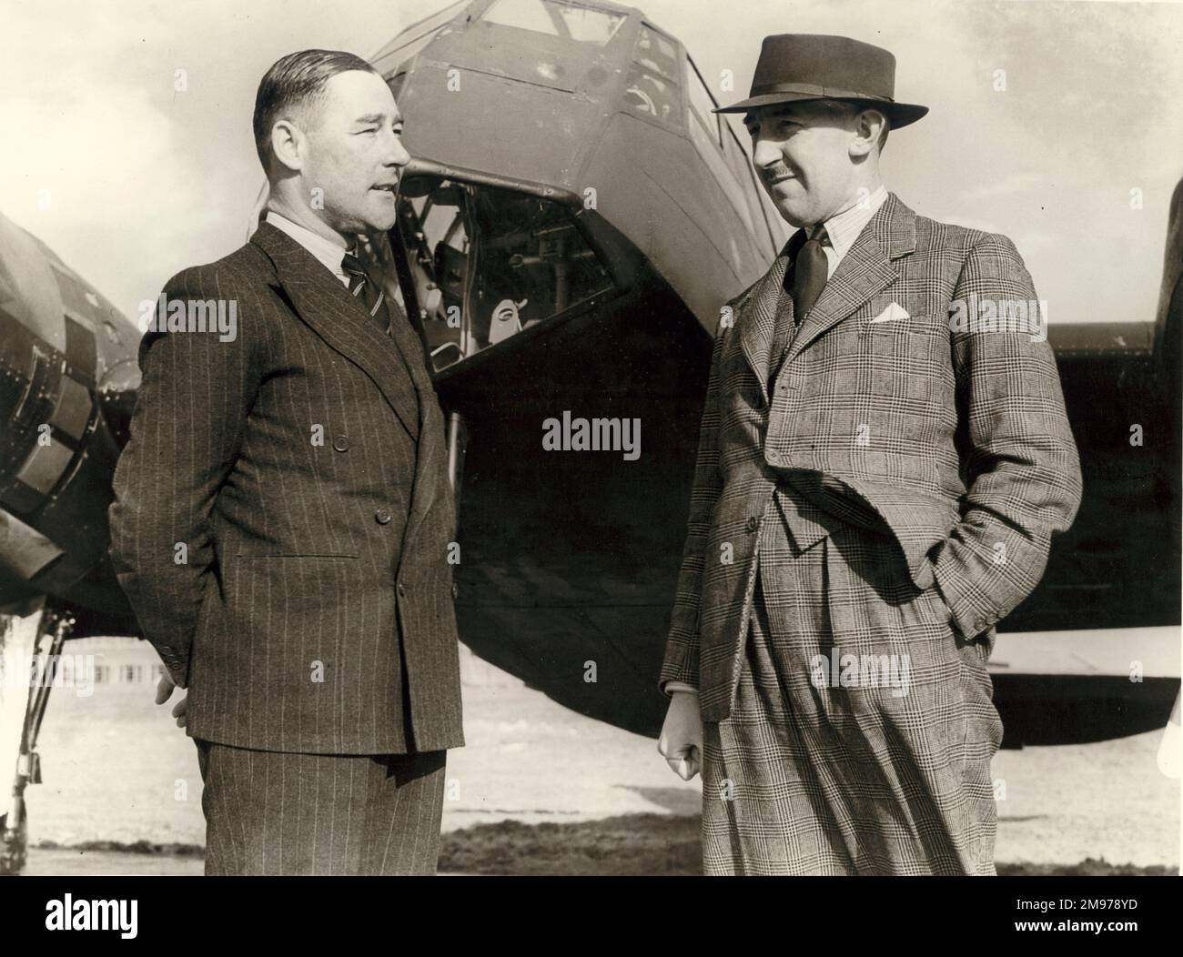 Bill Pegg, Bristol test pilot, left, and Cyril Uwins, chief test pilot, Bristol Aeroplane Company, in front of the first production Bristol Blenheim. Stock Photo