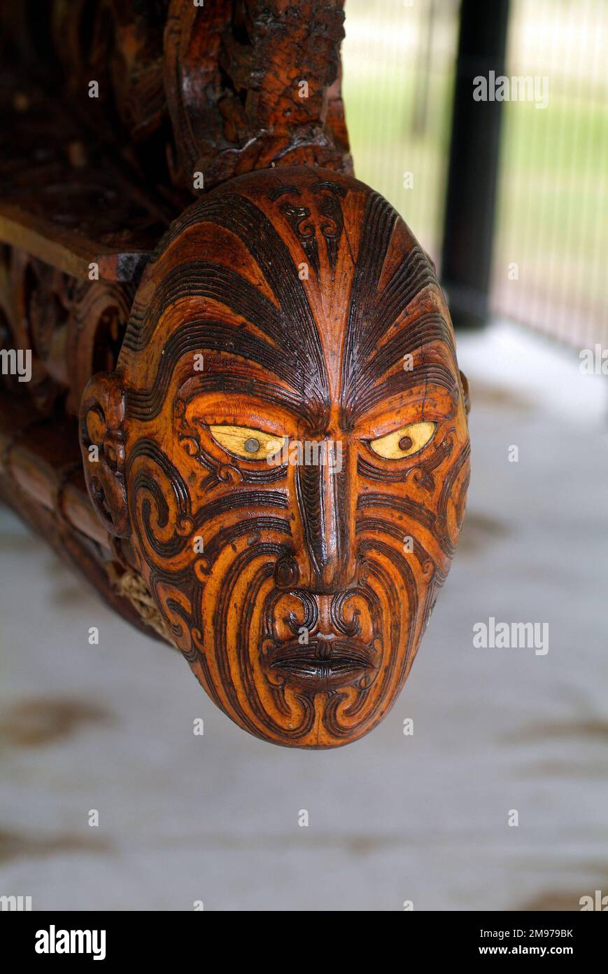 Rotorua, New Zealand, March 11, 2005: Carved bow head of a Maori wooden war canoe Stock Photo