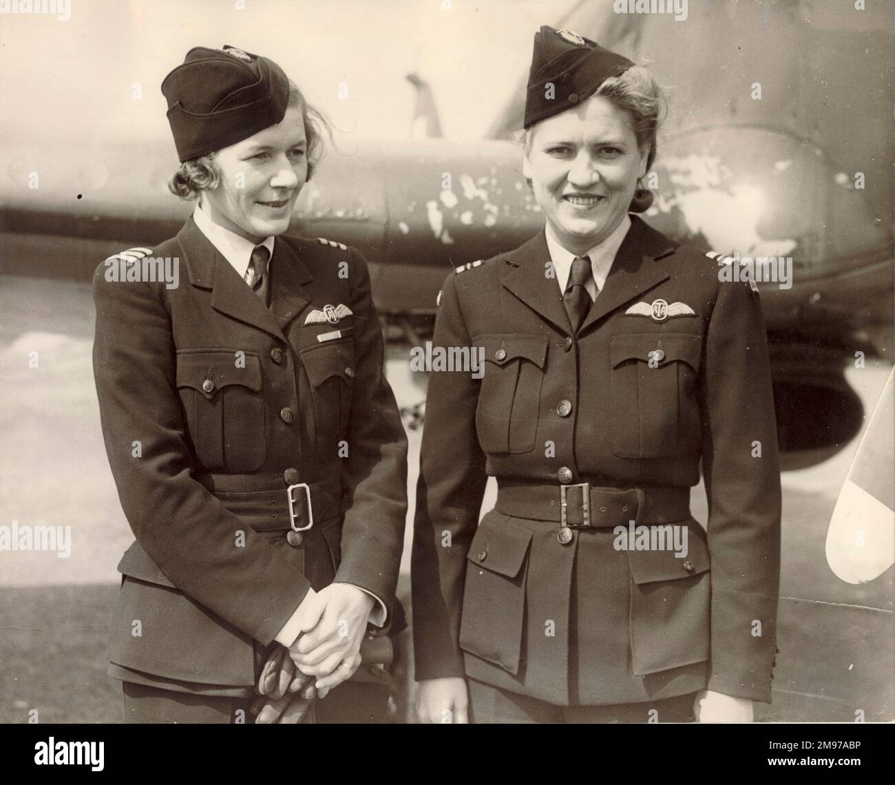 American and British members of the Air Transport Auxiliary in front of a Hawker Hurricane. From left: Pauline Gower, Commander and Jacqueline Cochran, Flight Captain in charge of the American Women pilots welfare. Stock Photo