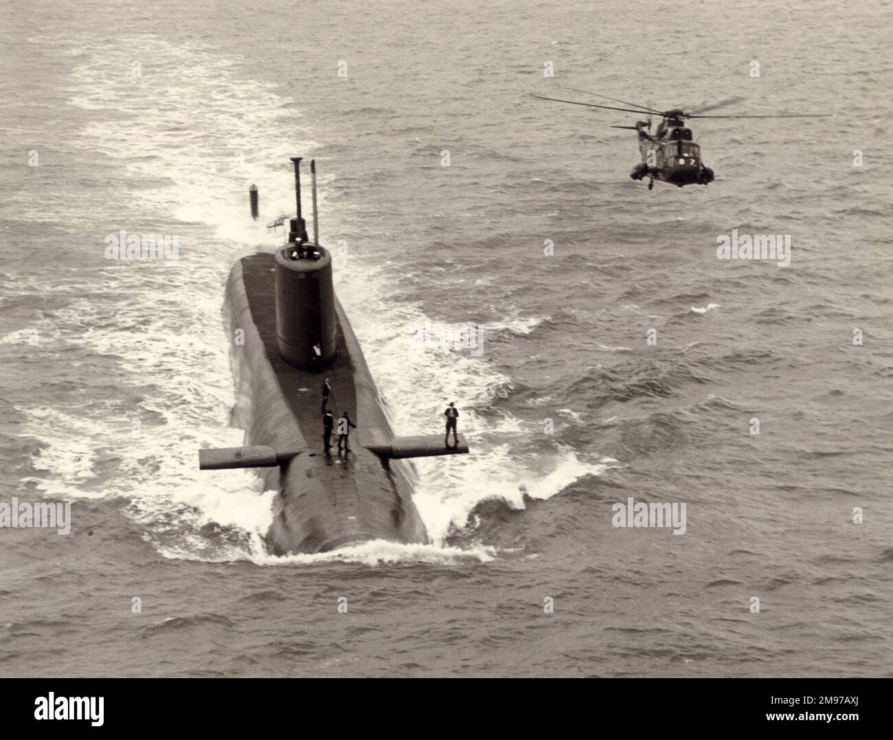 A Royal Navy Sea King alongside a submarine Stock Photo Alamy