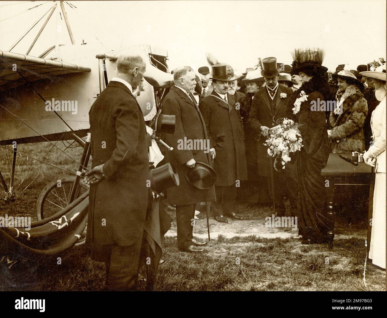 Lord and Lady Desborough at the London aerodrome dedicating a Blériot monoplane to the Australian commonwealth with Gustav Hamel, among others, at the naming ceremony of the Blériot monoplane named Britannia used by Hamel in his cross-Channel flight presented to the Government of New Zealand by agents for colonial corporations and The Standard newspaper. Stock Photo