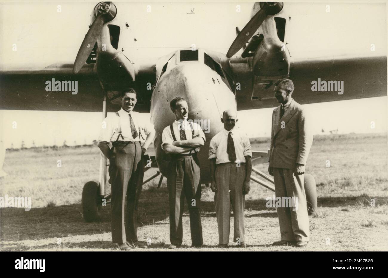 From left: Lawrence James Wackett, Sir Charles Kingsford Smith, White and Alsopp in front of the LJW6 Codock, the first twin-engine monoplane designed by Wackett. Stock Photo