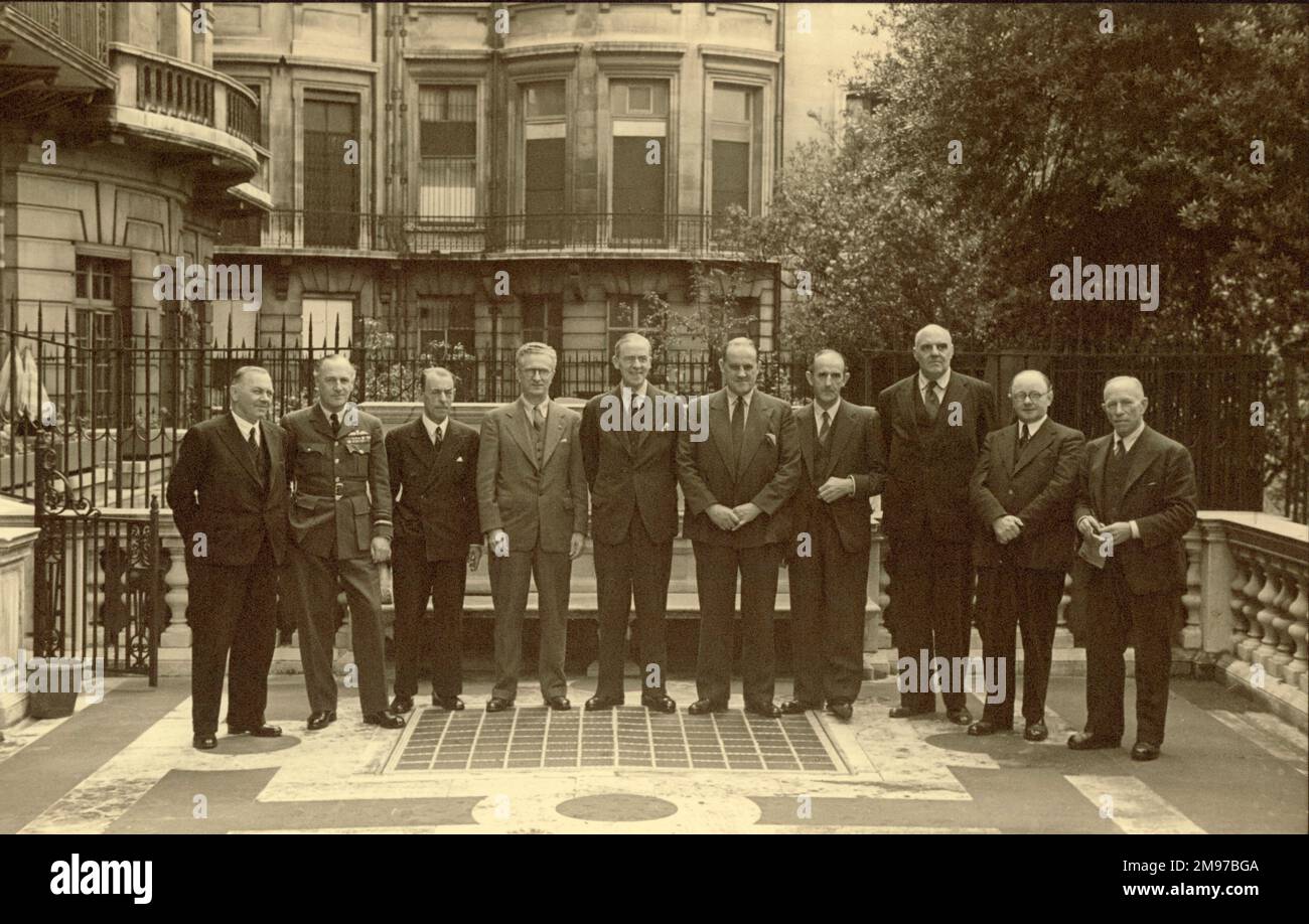 The Royal Aeronautical Society Advisory Committee to the Ministry of Production, appointed in 1941, on the terrace behind No.4 Hamilton Place. From left: Sir Arthur Gouge, Chief Desiner, Short Brothers, AVM Sir Ralph Sorley, CRD Ministry of Supply; Capt J.L. Pritchard, RAeS Secretary and Secretary of the Committee; T.P. Wright, USA, Guest of the Committee for one meeting; Sir Stafford Cripps, Minister of Supply; Sir A.H. Roy Fedden, Chairman; S. Camm, Chief Designer, Hawker Aircraft; R.K. Pierson, Chief Designer, Vickers; Dr L.A. Aitchison, Professor of Metallurgy, Birmingham University, and Stock Photo
