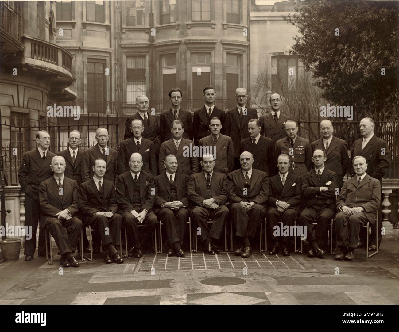 The Council of the Royal Aeronautical Society, 1943-1944, on the terrace behind No.4 Hamilton Place. From left, back row: A.G. Elliott, E.J.N. Archbold, R.S. Stafford, G.E. Petty and L.A. Wingfield. Middle row: Capt J.L. Pritchard, A.C. Brown, C.C. Walker, Sir Francis Shelmerdine, Major F.B. Halford, S.H. Evans, G.H. Dowty, F.R. Banks, W.C. Devereux and Capt A.G. Lamplugh. Front row: Major B.W. Shilson, Major R.H. Mayo, Lord Brabazon of Tara, A. Gouge, Sir A.H. Roy Fedden, R.K. Pierson, Sir Oliver Simmonds, N.E. Rowe and Griffith Brewer. Stock Photo