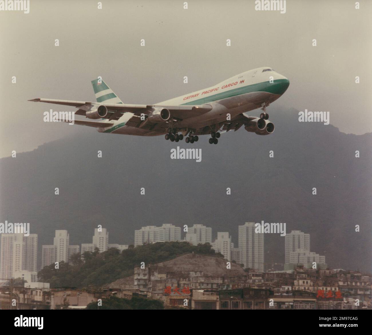 Boeing 747 of Cathay Pacific over Kai Tak airport, Hong Kong Stock