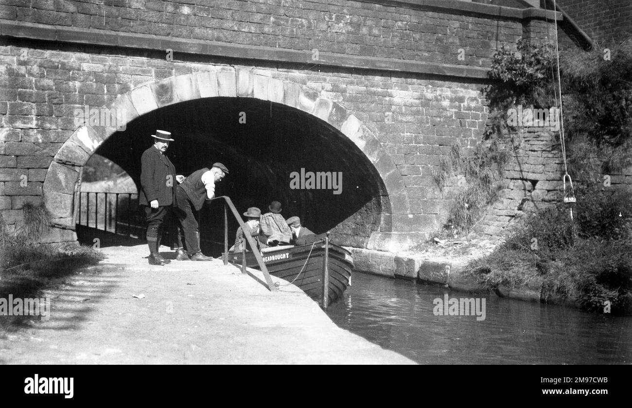Edwardian canal scene with rowing boat 'Dreadnought' - Stock Photo