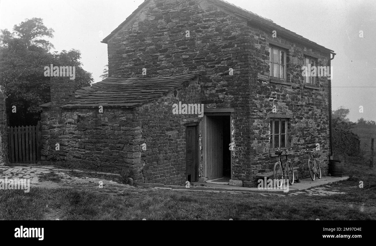 Stone built worker's house identified as the home of William Leigh - a stonemason - at Styperstone near Adlington in North East Cheshire. Stock Photo