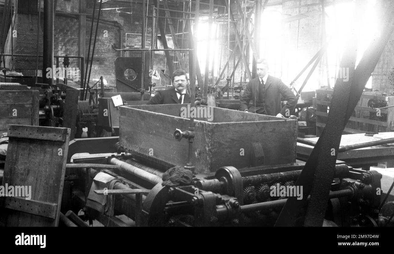 Machine plank shop at Battersby's hatworks with Walter Battersby on the right. The factory appears untidy by some modern standards, but the production from the factory was enough to satisfy a world market Stock Photo