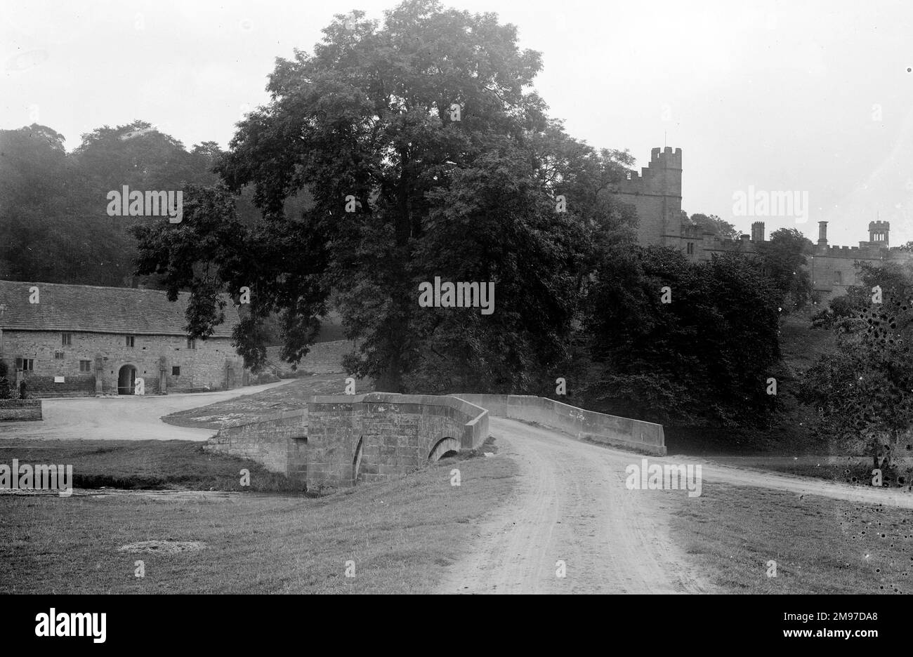 Haddon Hall seen in 1906 from the river bridge in a view only changed by the vegetation Stock Photo