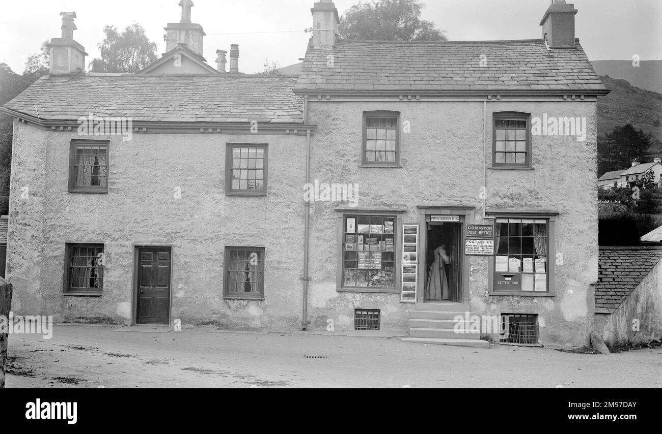 Coniston Post Office has moved from this location though this building is otherwise unchanged in Coniston village. Stock Photo