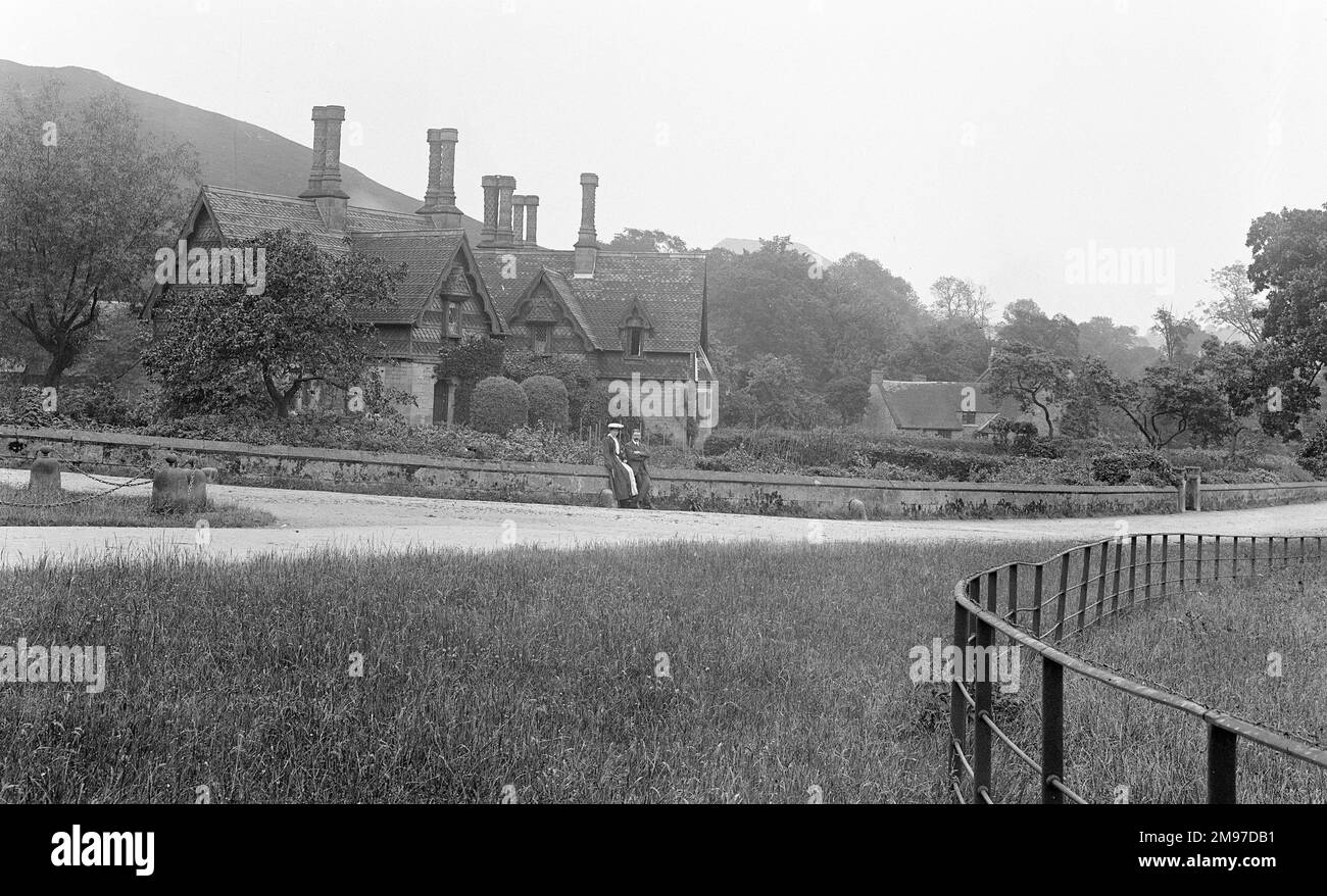 Ilam Hall, Derbyshire is still a tourist attraction in the picturesque village. The couple by the wall are James Johnson Battersby and his wife Nancy, brother and sister in law to the photographer. Stock Photo