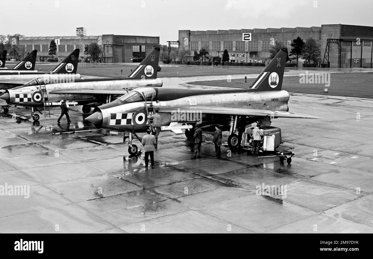 English Electric Lightning T.4 XM989 of 56 Squadron RAF at Wattisham on 16 June 1963 with other Lightning F.1As Stock Photo