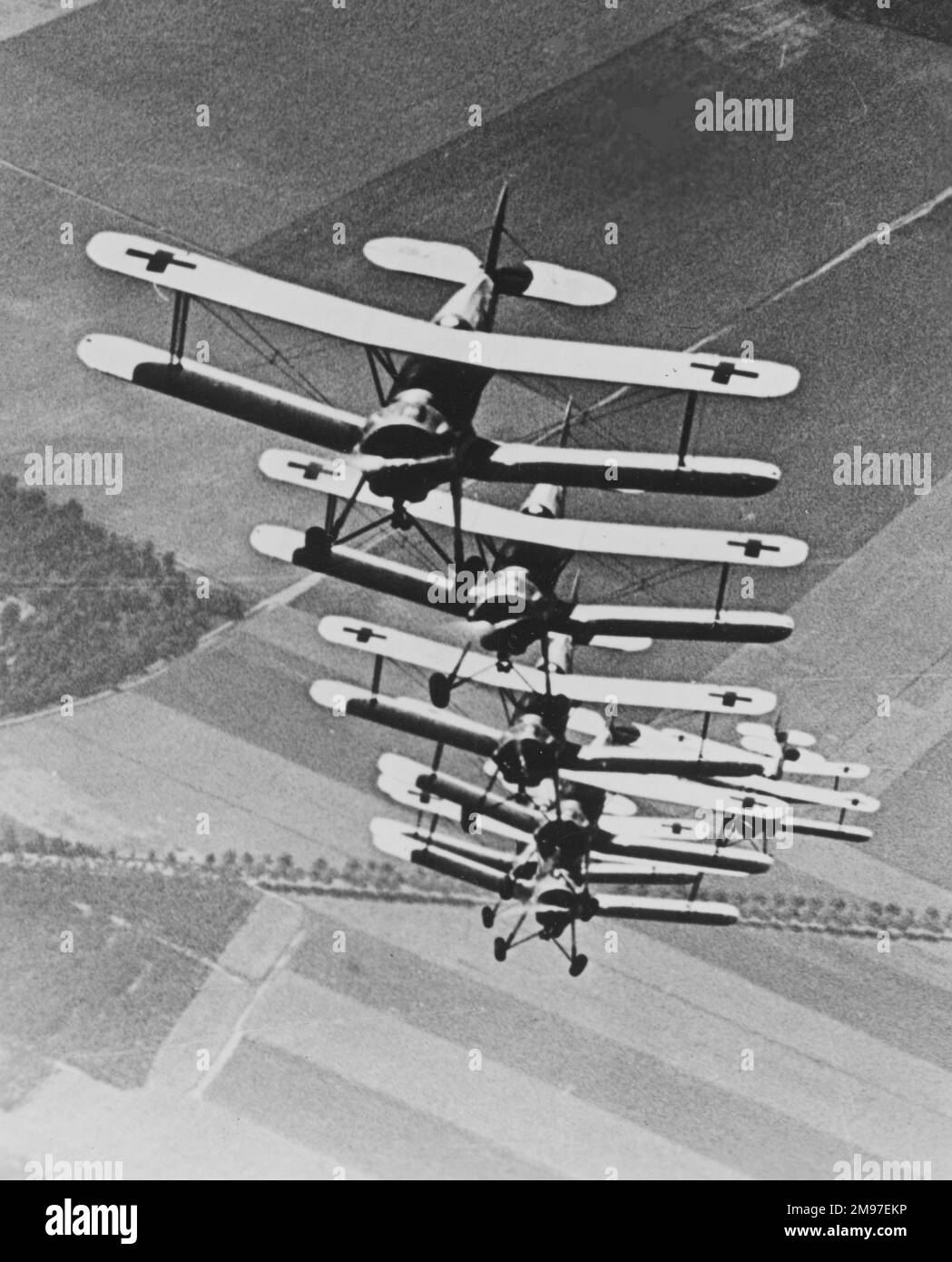 Bucker Bu 133 Jungmeister- a tight 7 plane fomation, good for teaching precise handling but not fighter tactics. Stock Photo