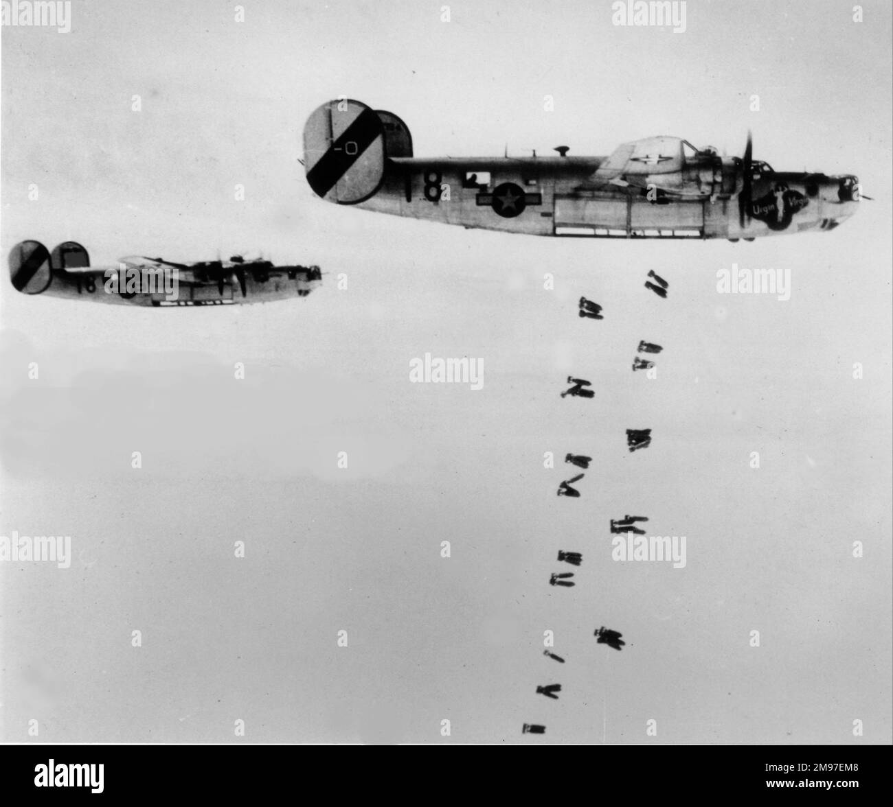 Consolidated B-24J pair aloft bombing. Stock Photo