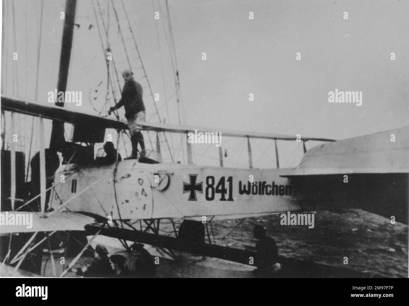 Friedrichshafen FF 33E German scout plane (serial no. 841), nicknamed the Wolfchen (Baby Wolf), seen here on a ship's hoist on 6 March 1918.  The plane carried out reconnaissance for the German merchant raider, SMS Wolf, from 30 November 1916 for a period of 15 months, when it flew without the national markings seen here. Stock Photo