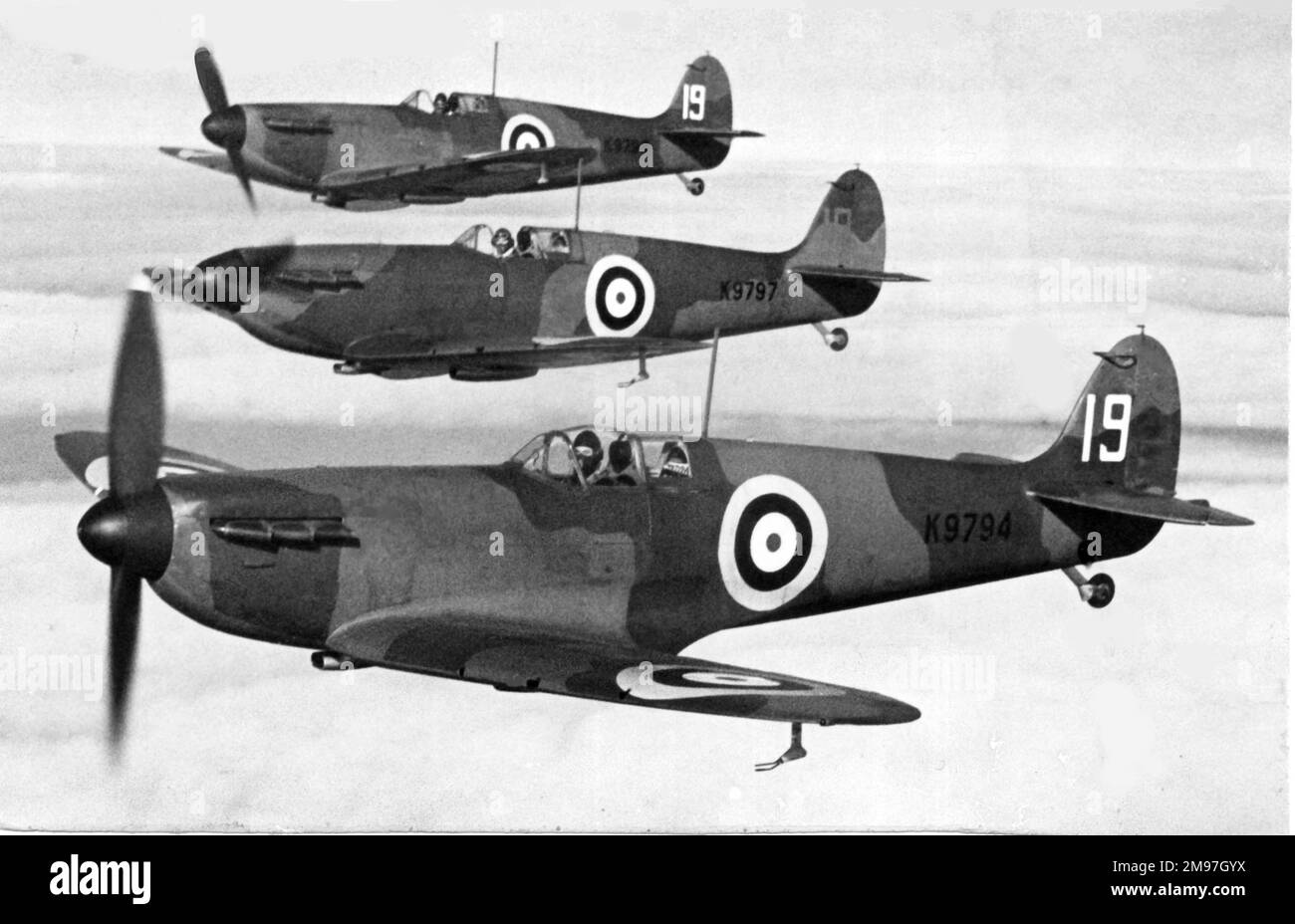 Supermarine Spitfire I trio aloft of 19 Sdn. Stock Photo