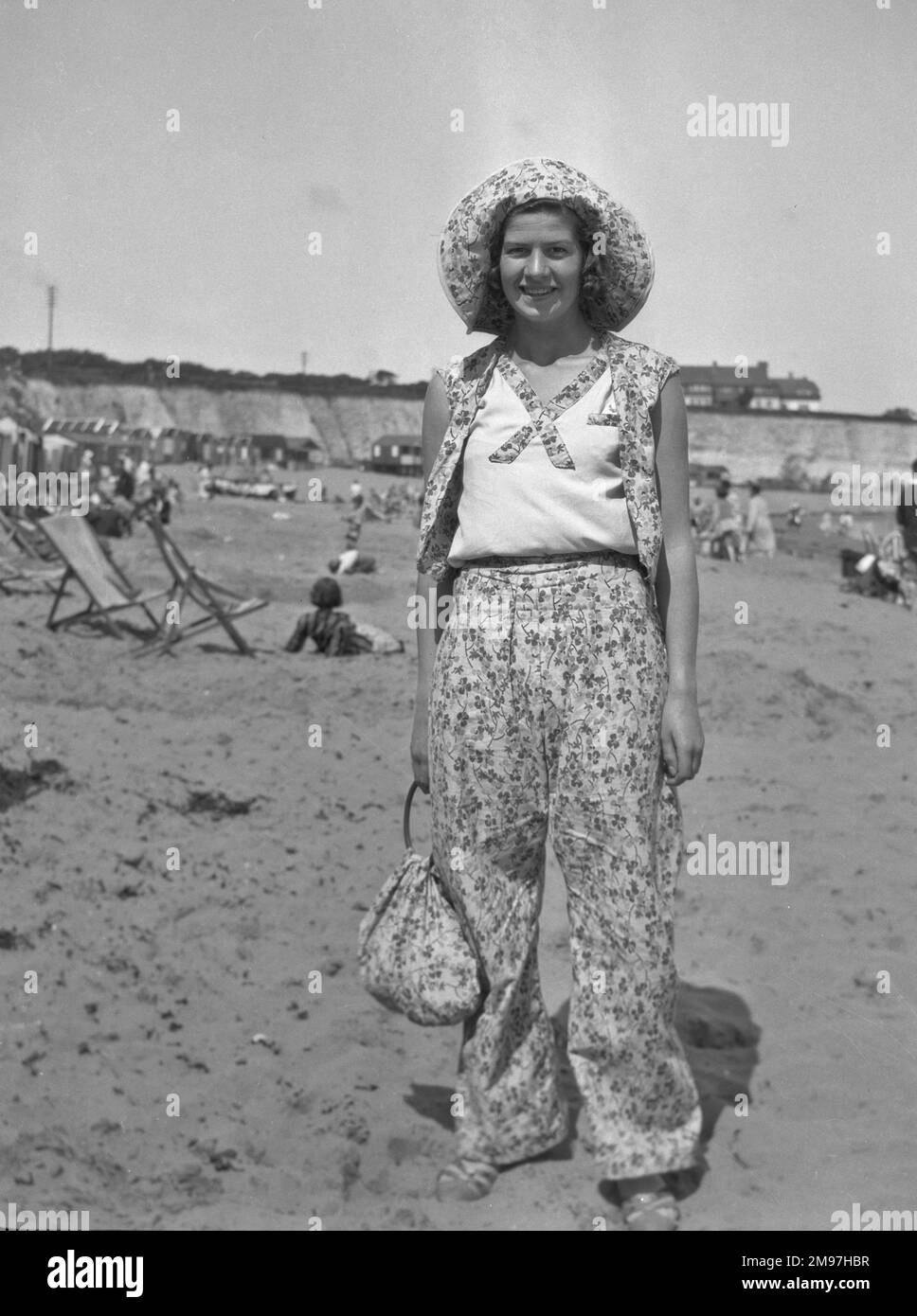 Woman on a beach at a seaside resort, 1930s Stock Photo