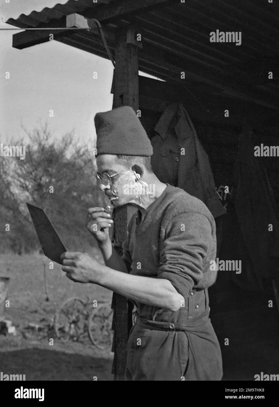Soldier shaving in the open air at a camp Stock Photo Alamy