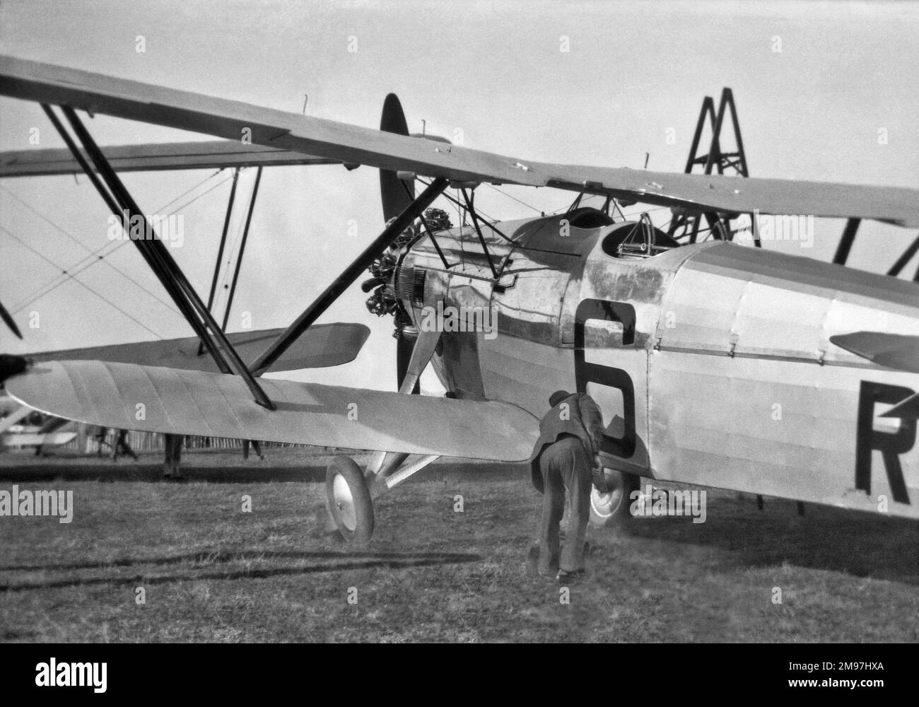 Biplanes in a field. Stock Photo