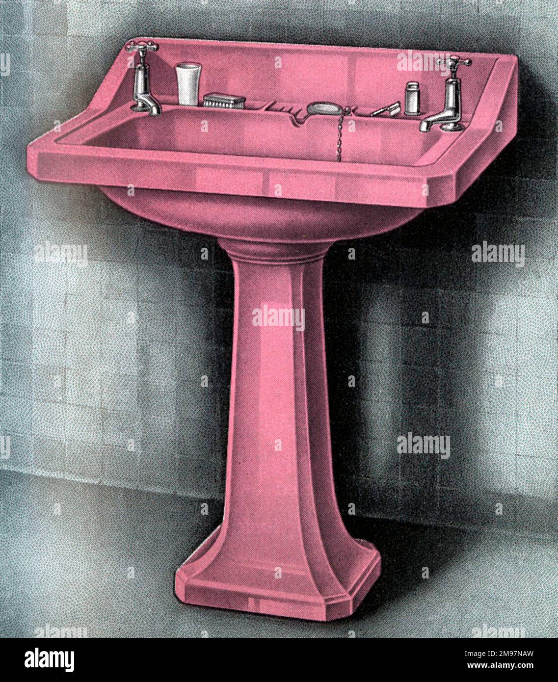 'Vitromant' Coloured pedestal Lavatory (Wash Basin / sink) in pink enamel with chromium plated fittings. Stock Photo