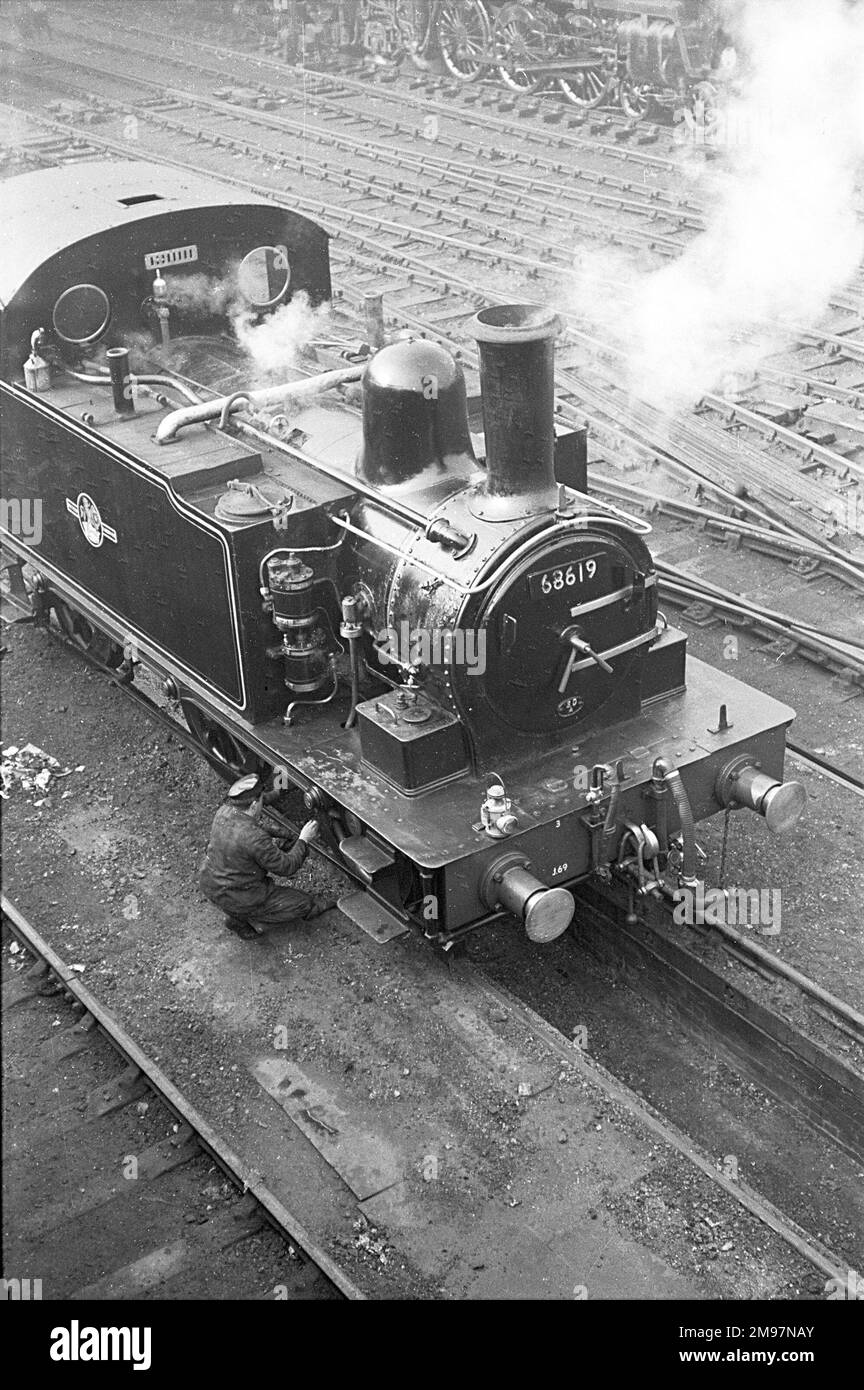 Railway engineer working on steam train, Liverpool Street Station