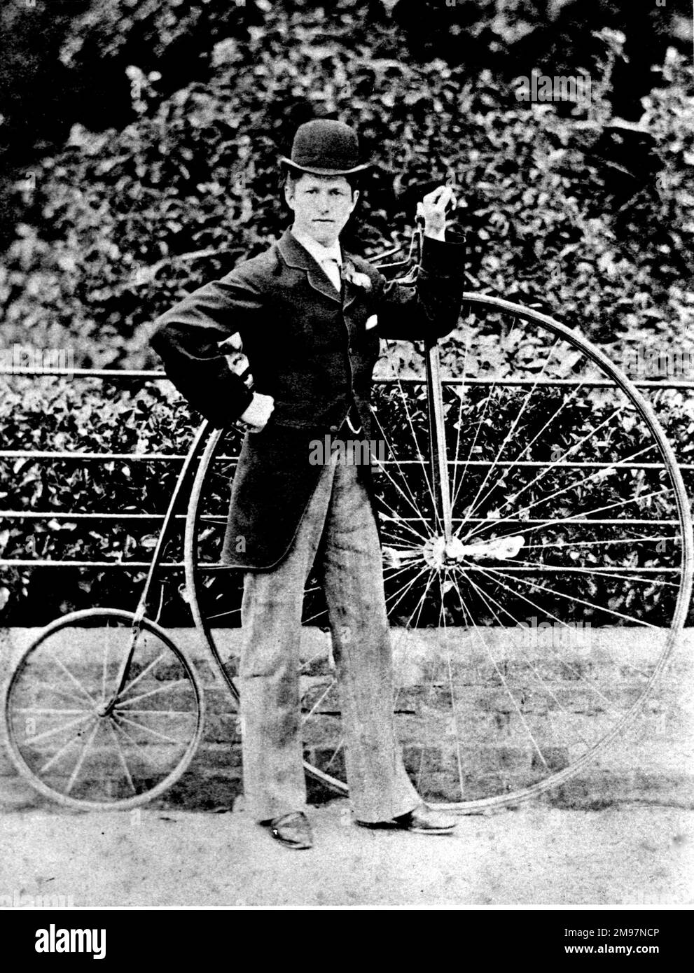 Proud owner and his penny farthing bicycle. Stock Photo