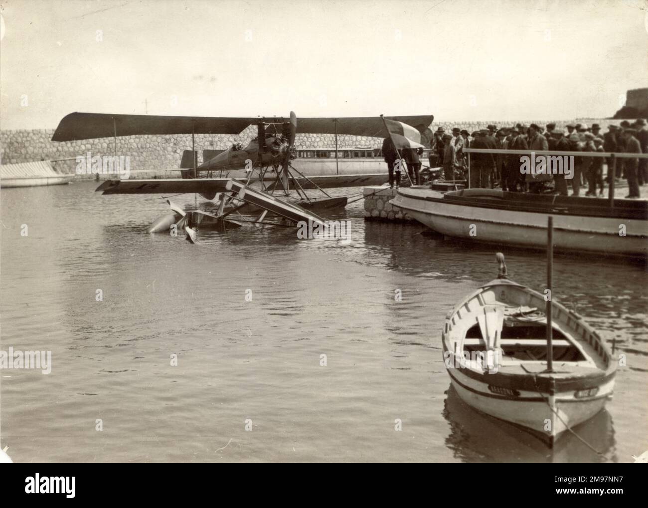 M. Bregi’s Breguet H1-U2 seaplane sheltering at Beaulieu. The wreck of M. Weymann’s Nieuport is in the foreground at the Monaco Schneider Trophy Contest, 12 April 1913. Stock Photo