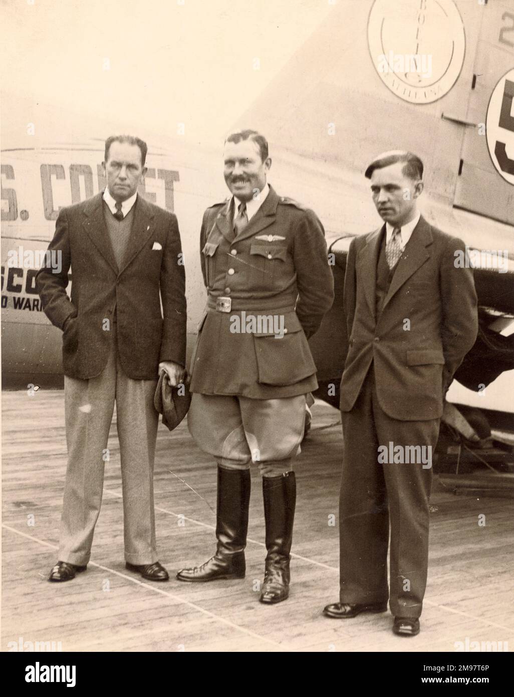 From left: Clyde Edward Pangborn, Col Roscoe Turner and Reeder Nichols, the crew of Boeing 247D, NR257Y, Warner Bros. Comet, on their arrival at Plymouth on the Washington prior to the MacRobertson England to Australia race of October 1934. Stock Photo