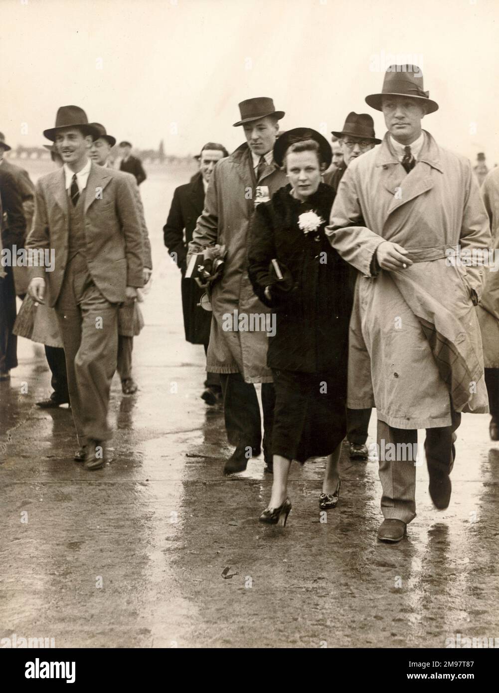 From left Giles Guthrie, Greta and C.W.A. Scott walk across the