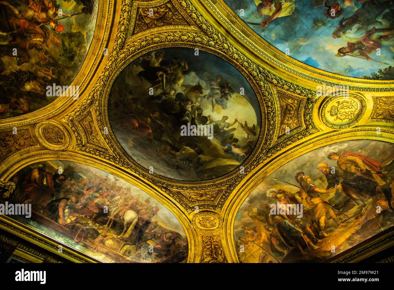 Paris, France - Dec. 28 2022: The highly decorative chandelier in Versaille Palace Stock Photo