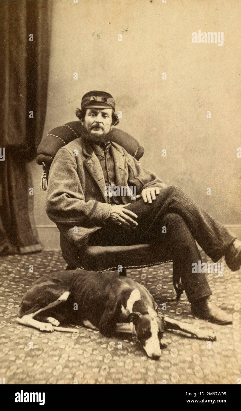 Abraham Foster with greyhound, studio portrait. Stock Photo