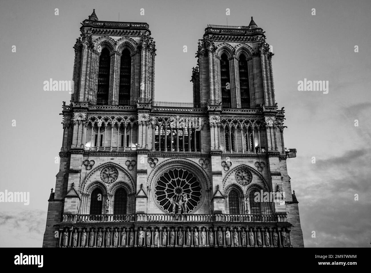 Paris, France - Dec. 27 2022: Black and White Notre Dame Cathedral in night Stock Photo