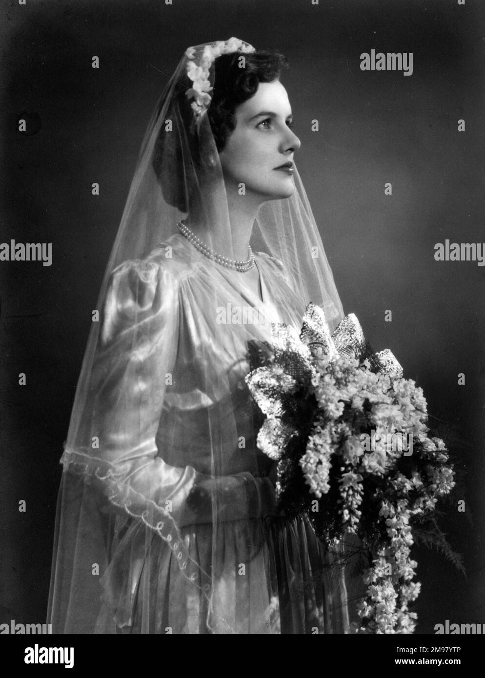Bride with bouquet on her wedding day. Stock Photo