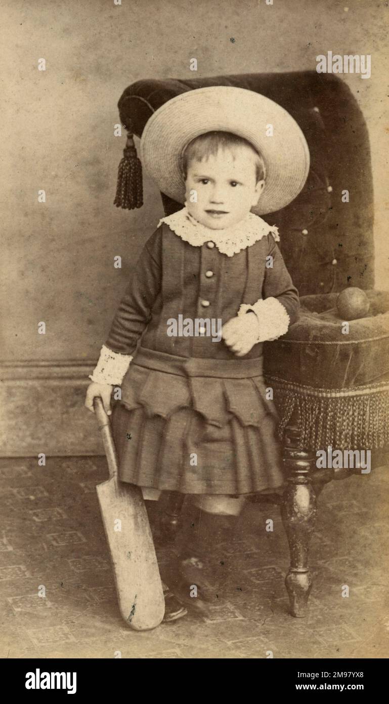 Studio portrait of a Victorian child with cricket bat, Otley, Yorkshire. Stock Photo