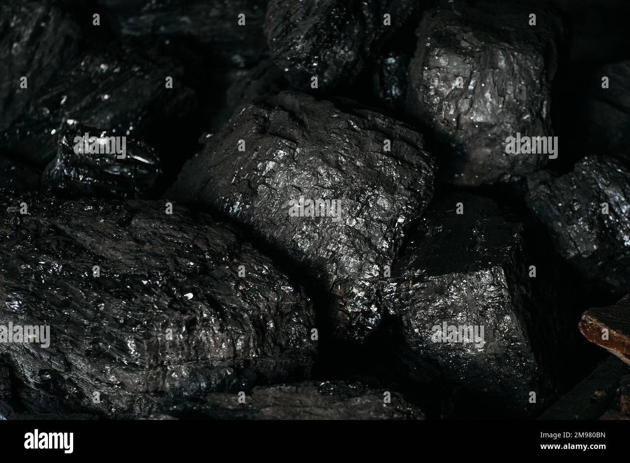 Black coal stones close-up. Solid advertising background.. Stock Photo