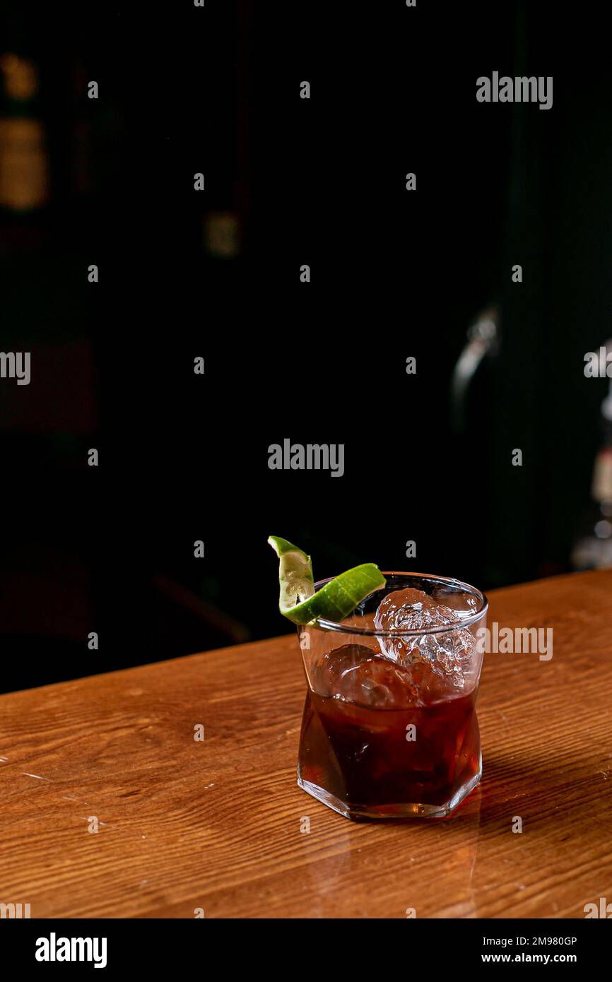 A glass of negroni served on a bar counter Stock Photo Alamy