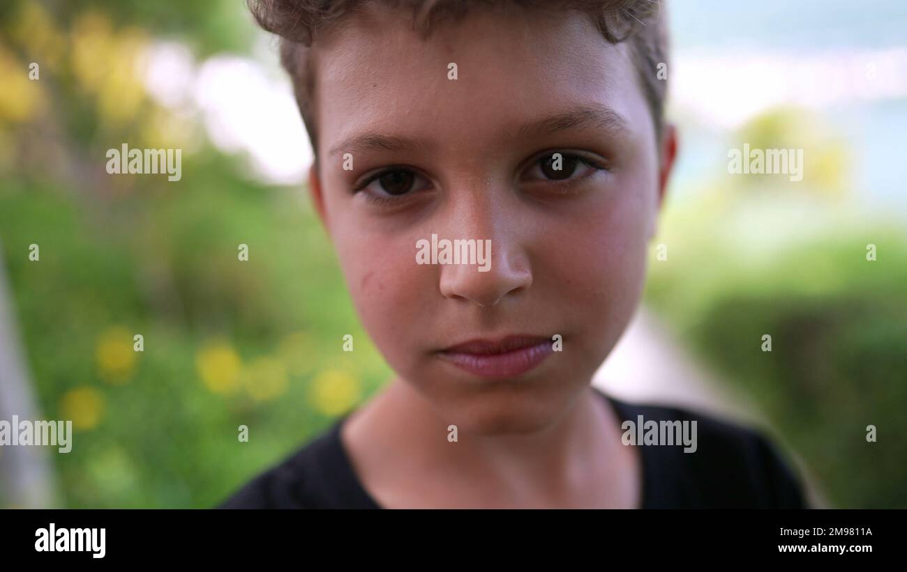 Handsome young boy portrait child smiling at camera outside Stock Photo ...