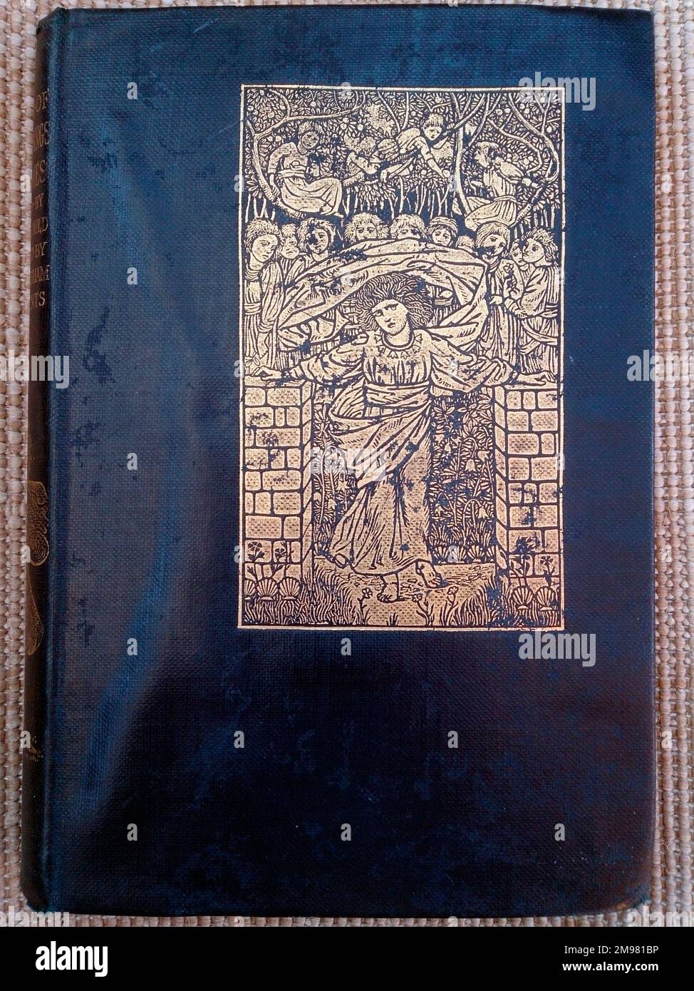 Book cover in blue and silver, A Book of Nursery Songs and Rhymes, edited by S Baring-Gould, with illustrations by members of the Birmingham Art School under the direction of A J Gaskin. The scene probably refers to the rhyme, Mary Mary Quite Contrary. Stock Photo