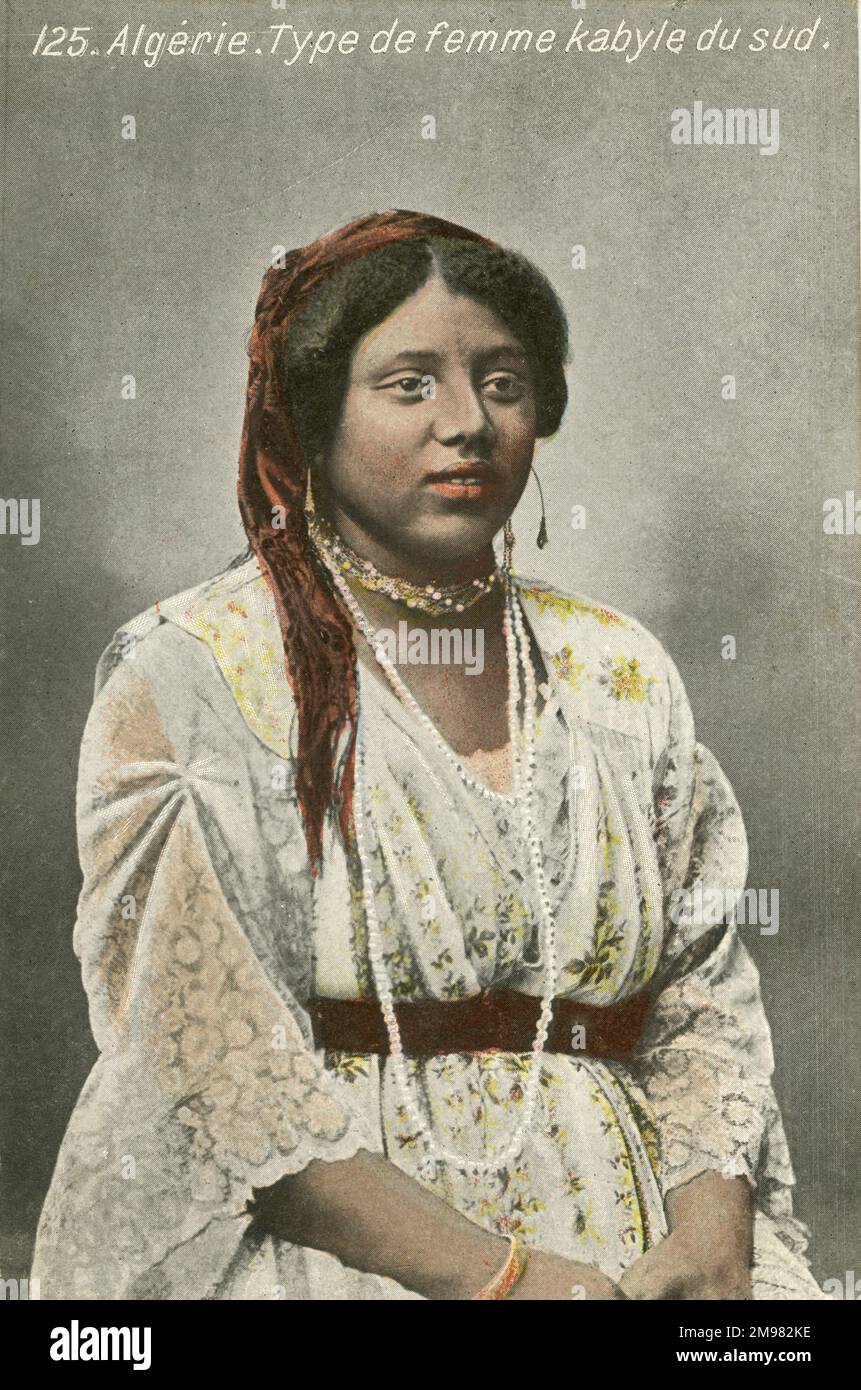 A coloured photograph of a Kabliyan woman. She wears traditional dress and jewellery. Stock Photo