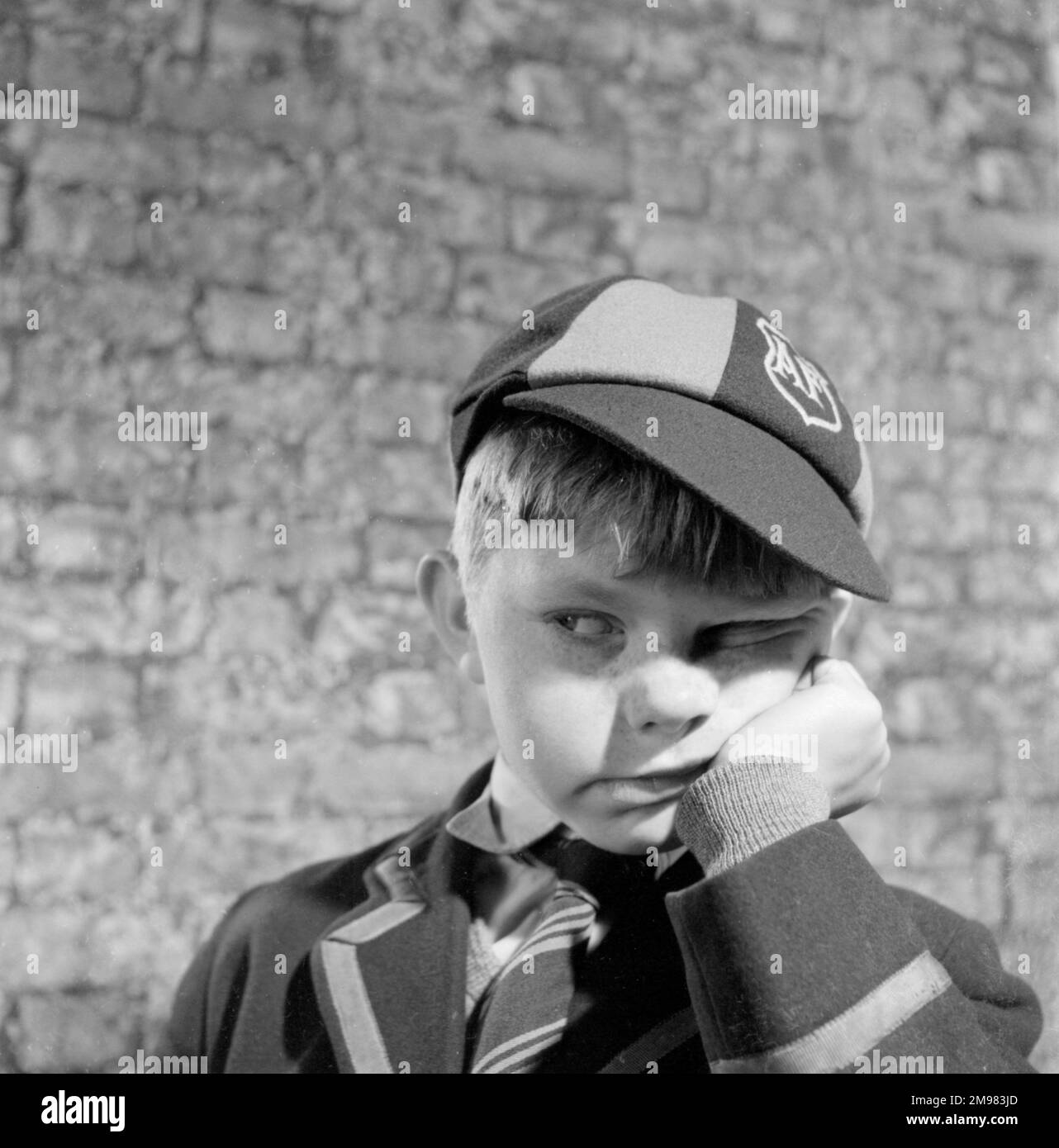 Advertisement for National Benzole petroleum -- boy model (Denis Gilmore) in school uniform. Stock Photo