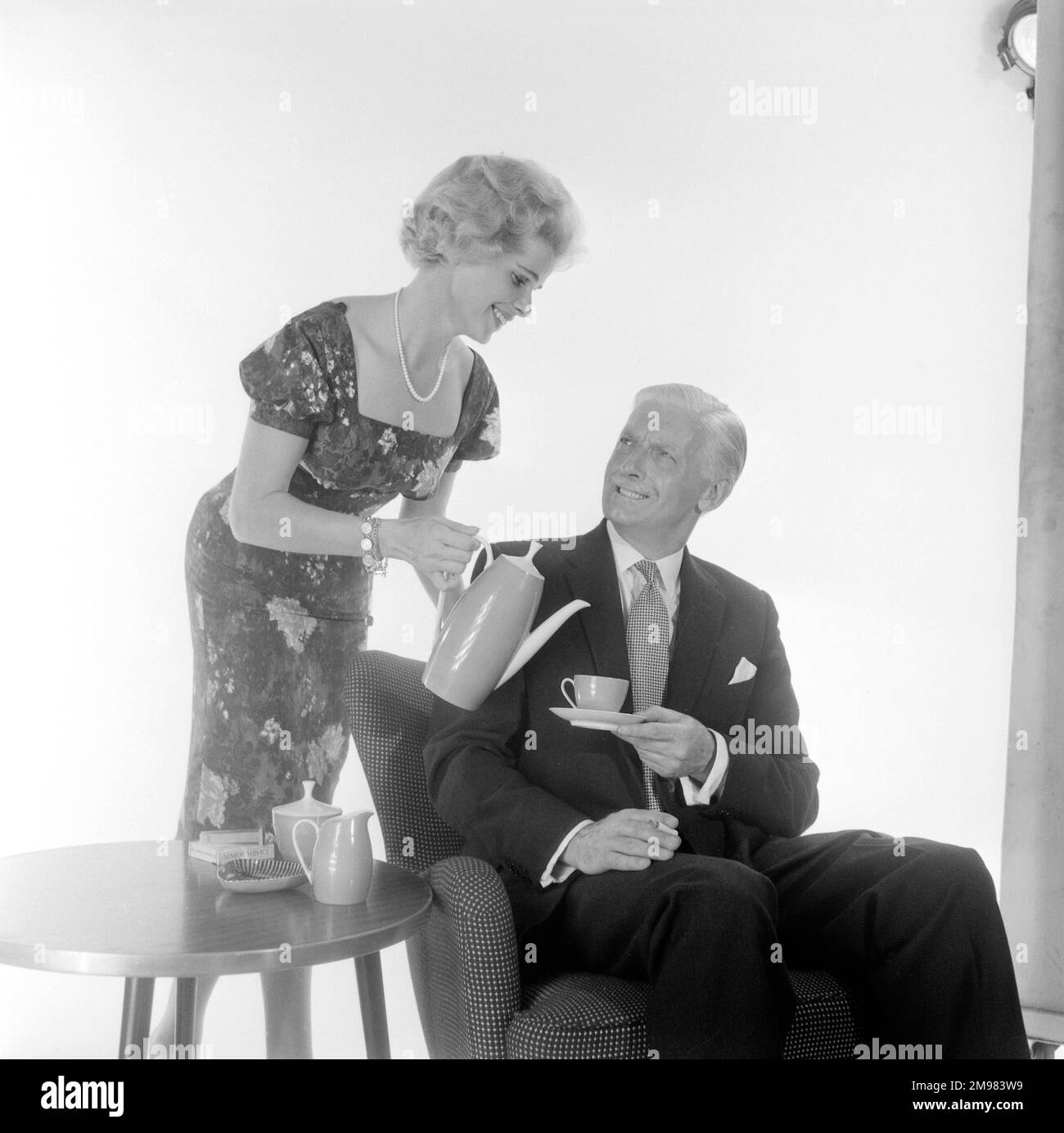 Advertisement for Nescafe -- male and female models posing (Pat Dixon and George McGrath). Stock Photo