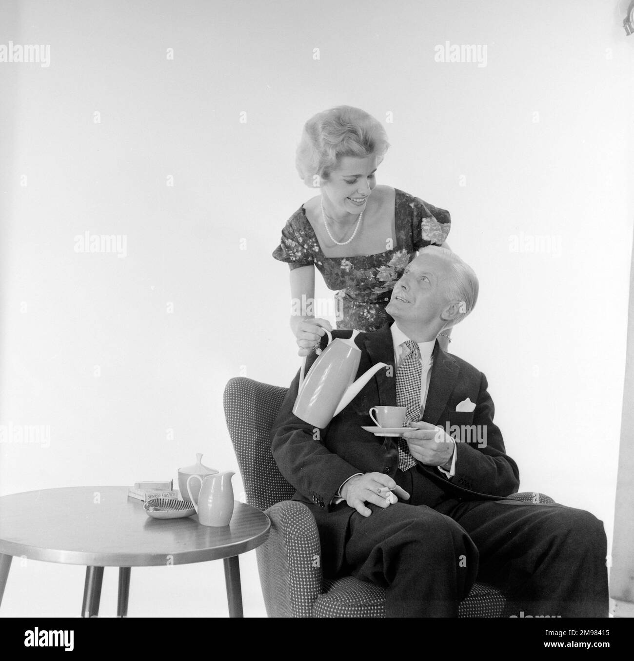 Advertisement for Nescafe -- male and female models posing (Pat Dixon and George McGrath). Stock Photo
