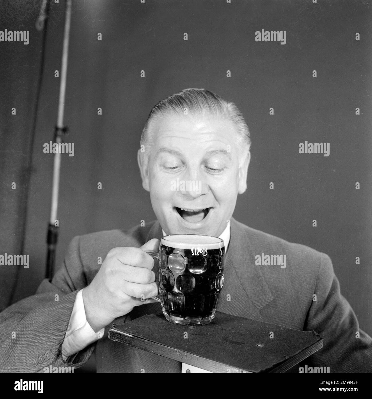 Advertisement for M&B Mild Beer -- male model (Vincent Charles) posing with a pint glass. Stock Photo