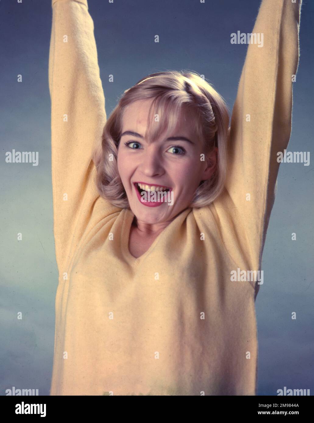 Advertisement for Pepsodent toothpaste female model wearing a yellow